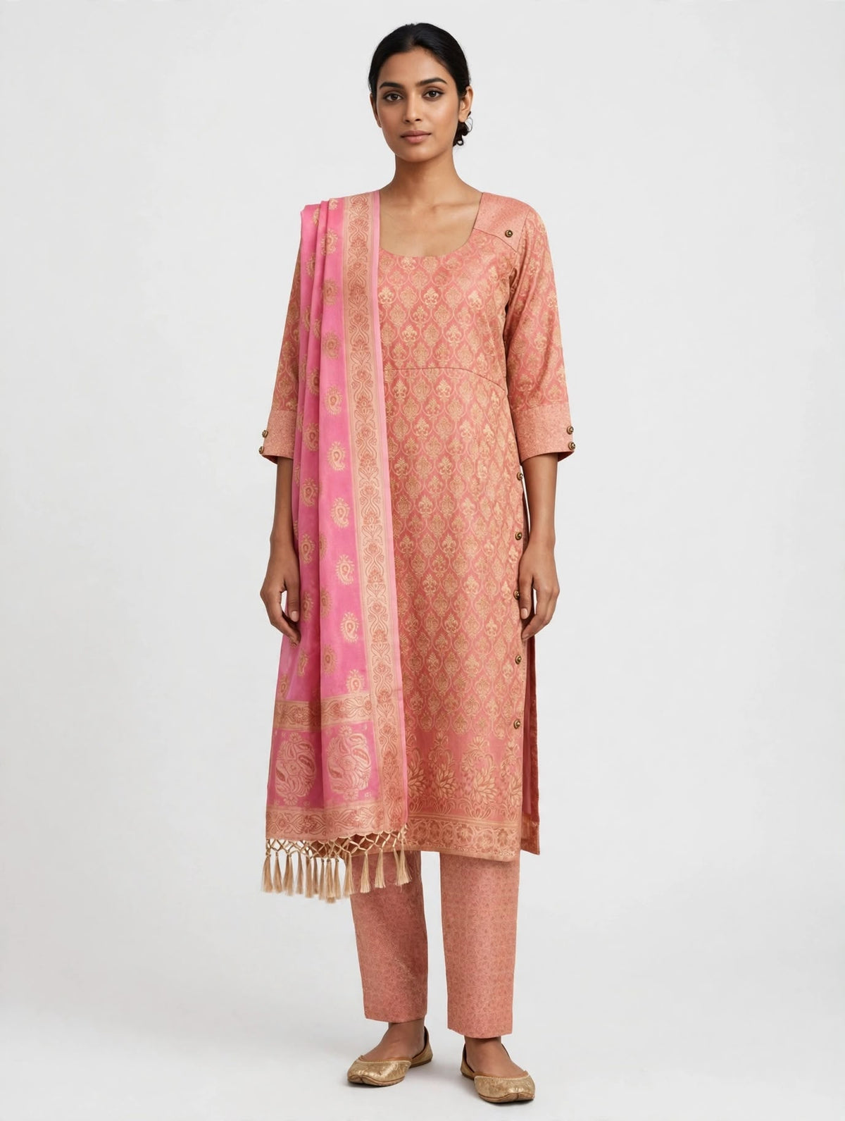 A three-piece suit in dusty rose peach